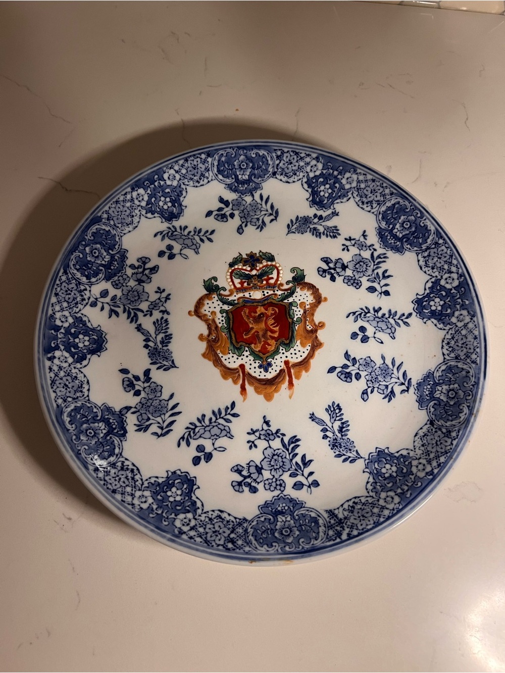 Vintage blue and white plate with crest
